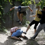 Gay pride organiser Svyatoslav Sheremet is beaten up by thugs in Kiev on 20 May 2012 (Reuters)